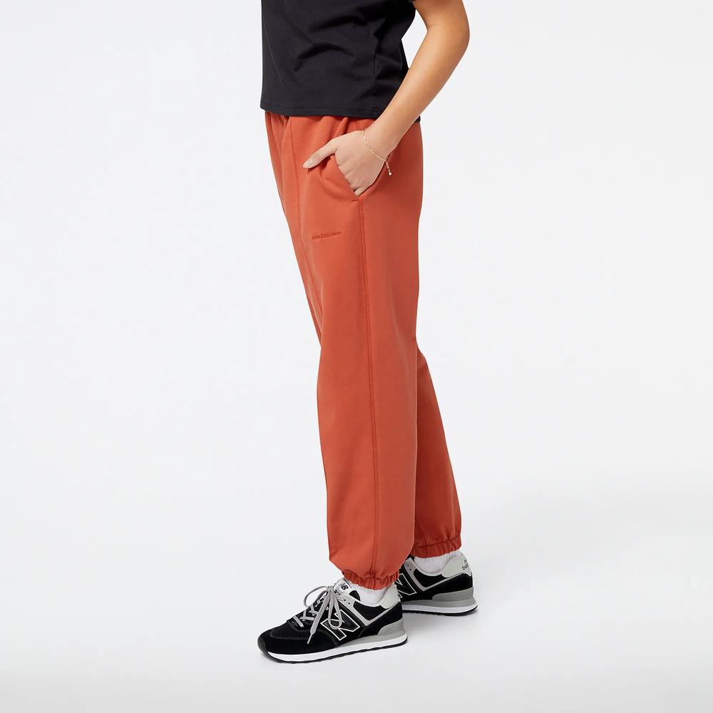 Nohavice New Balance WP23553MHY - hnedé