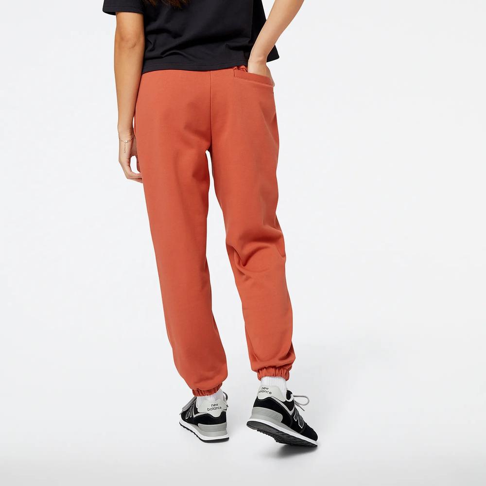 Nohavice New Balance WP23553MHY - hnedé