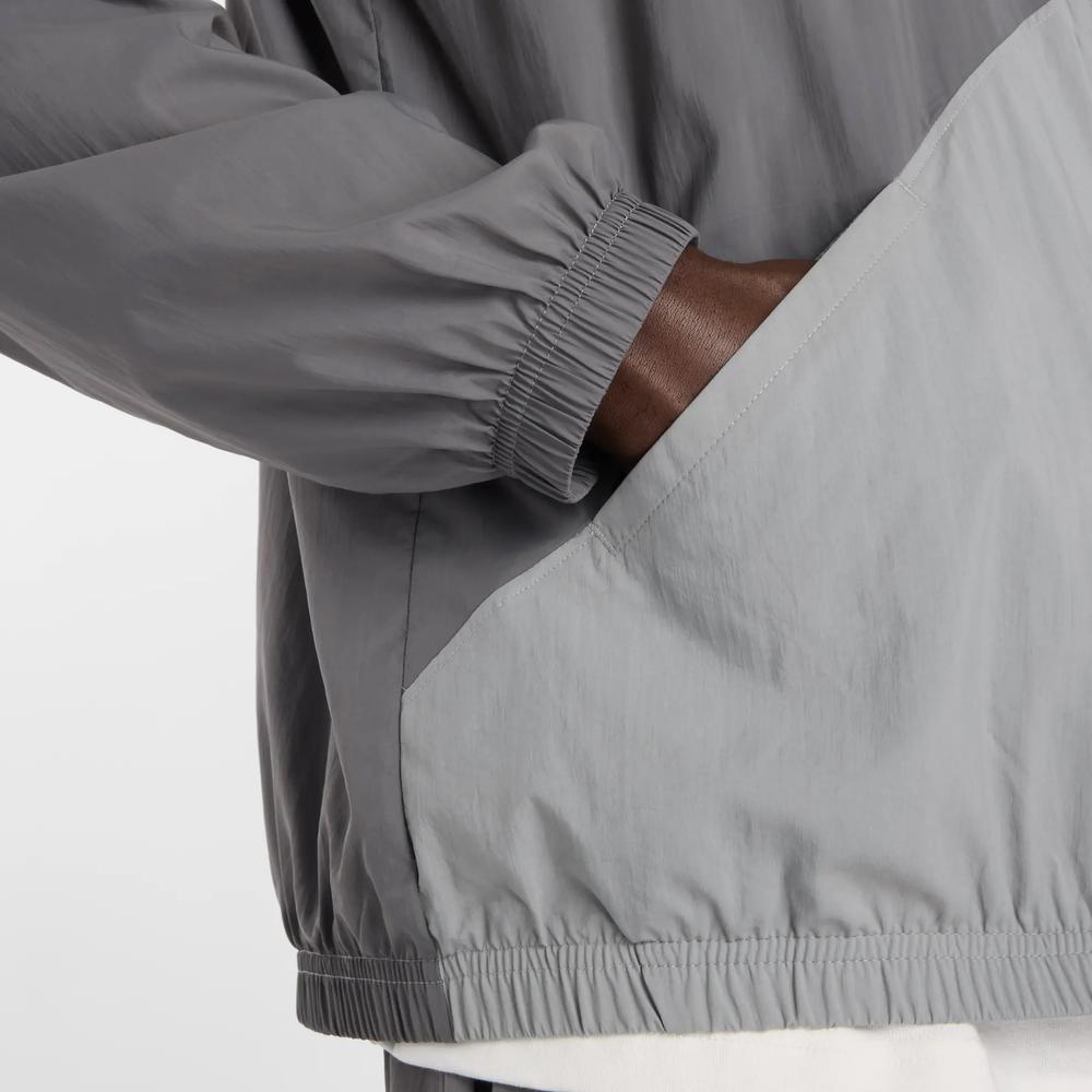 Mužský vetrovka New Balance MJ61J73YCAS - šedý