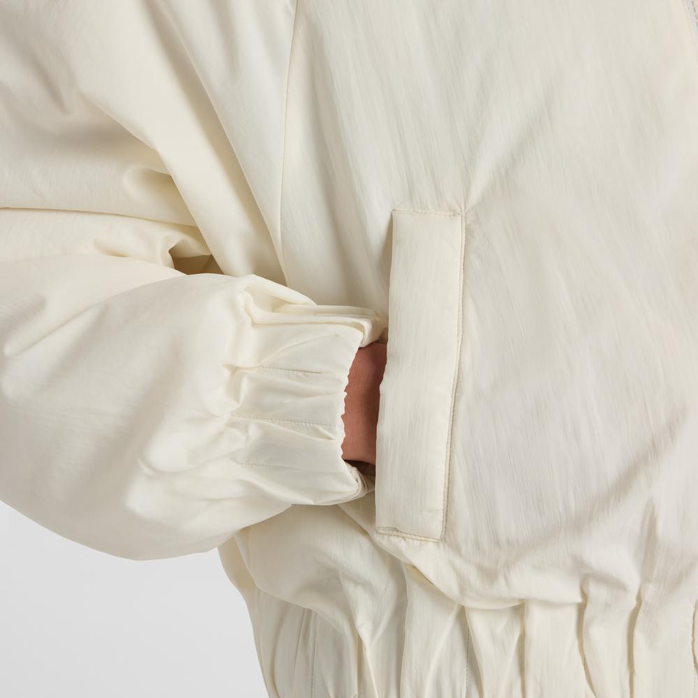 Dámská bunda New Balance WJ61D8YXSST - béžové