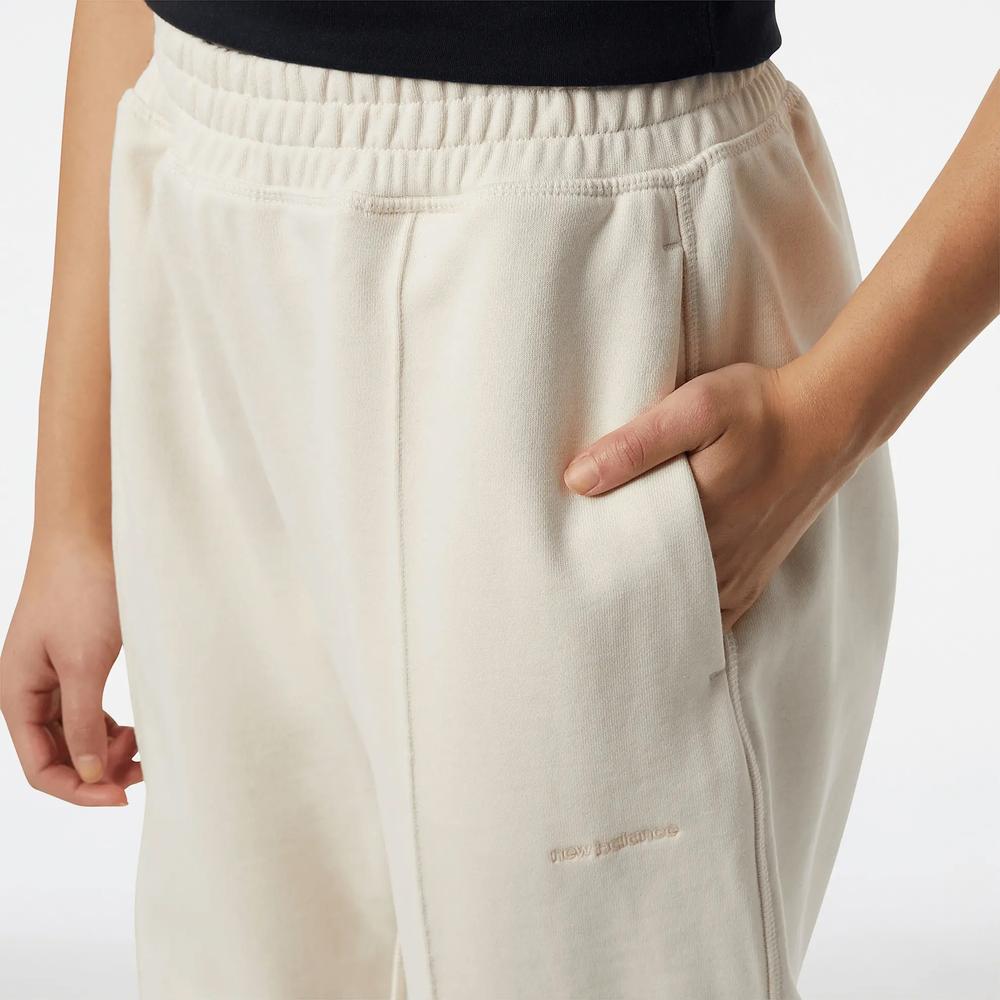 Nohavice New Balance WP23553GIE – béžové