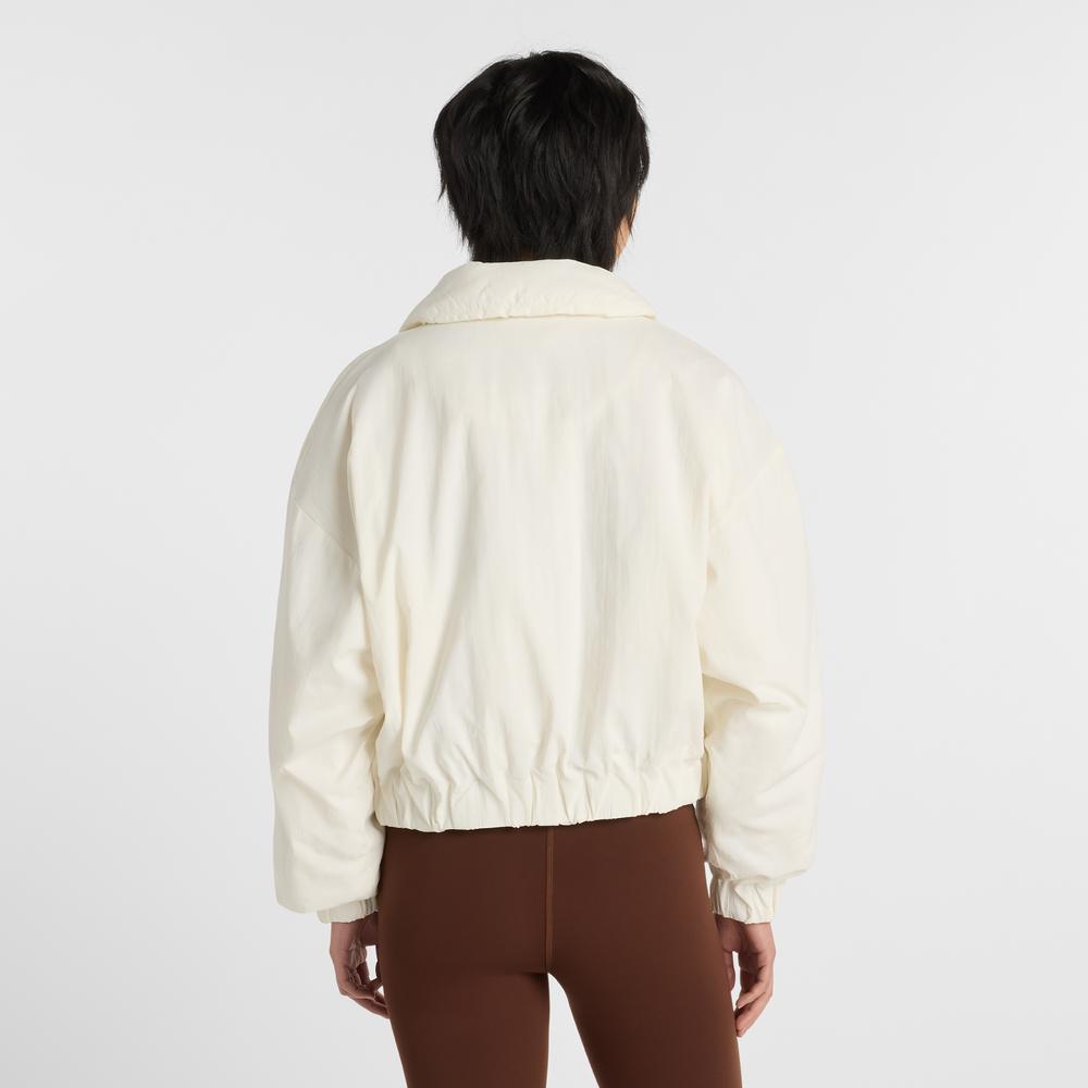 Dámská bunda New Balance WJ61D8YXSST - béžové