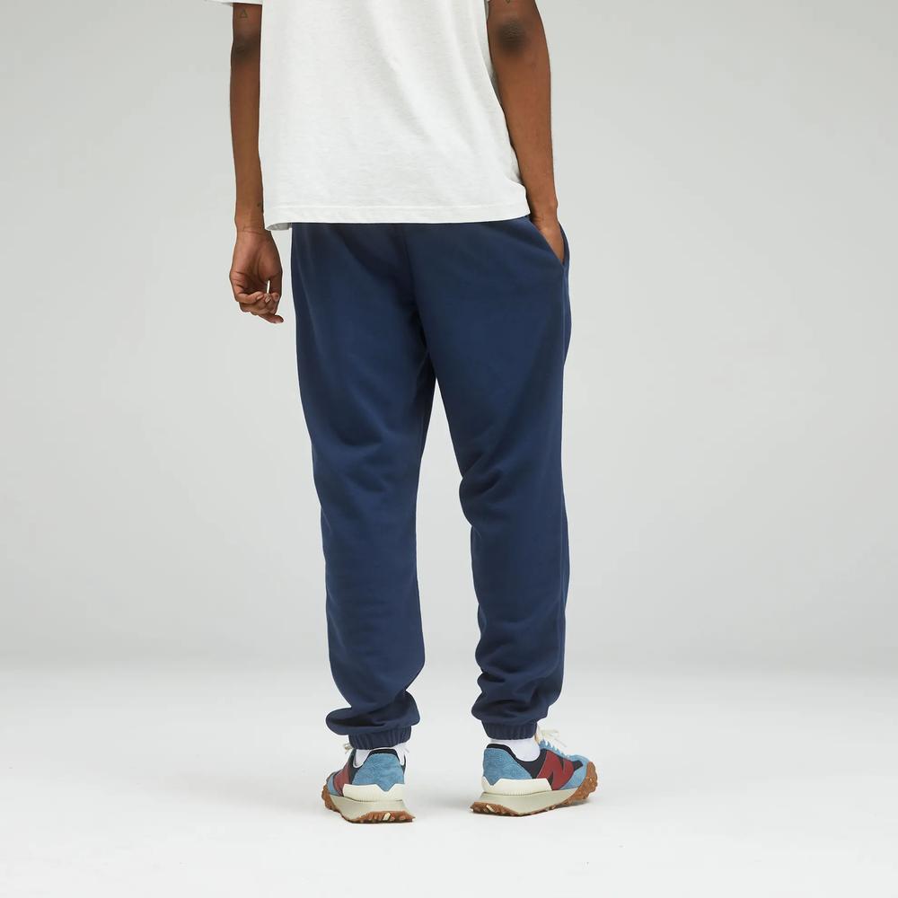 Nohavice unisex New Balance UP21500NGO – tmavomodrá