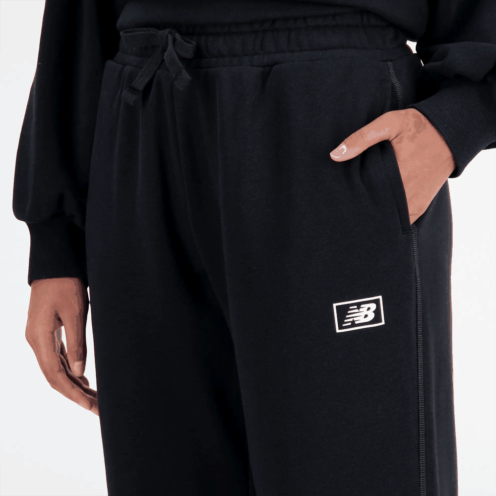 Nohavice New Balance WP33508BK – čierne